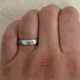 simple 5mm wedding band handcrafted in platinum, with a brushwork finish