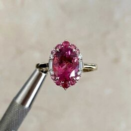 Zarya Ring with Additional pink tourmaline’s and single-cut diamonds forming a halo around the center stone