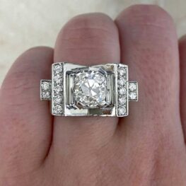 vintage mauboussin ring featuring a prong set antique cushion cut diamond