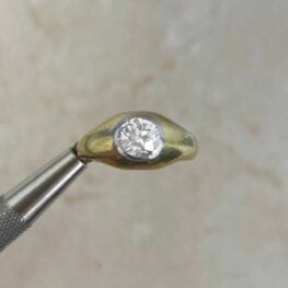 Taraz Ring with a bezel-set in platinum center diamond